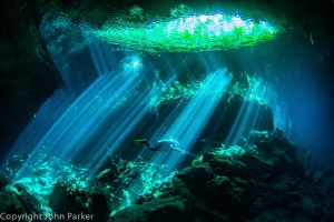 Cenote light show by John Parker 